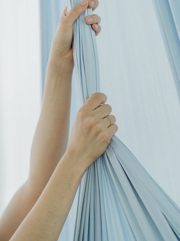 Close-up of hands in a mindful gesture during exercise.
