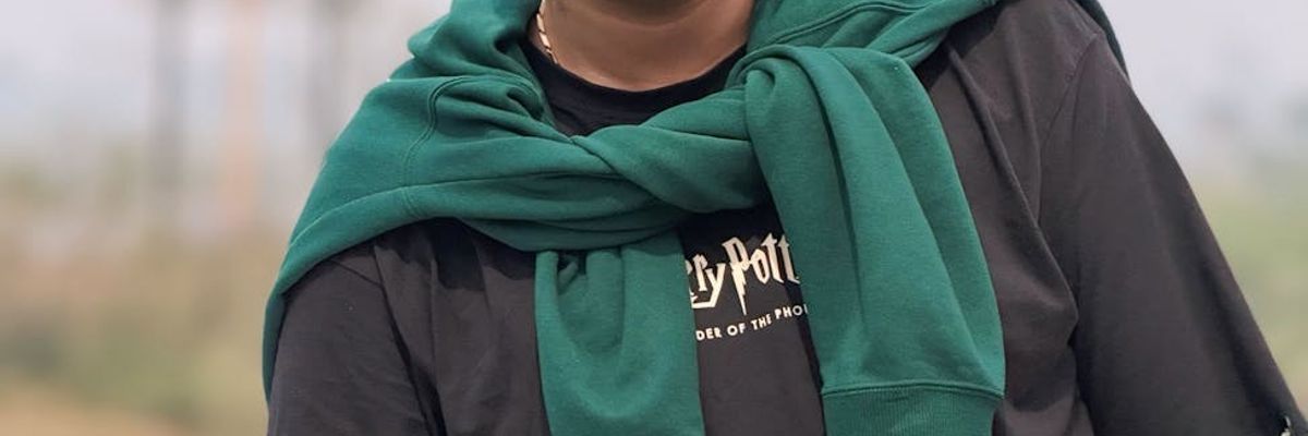 Person moving rhythmically against a dark, atmospheric background.